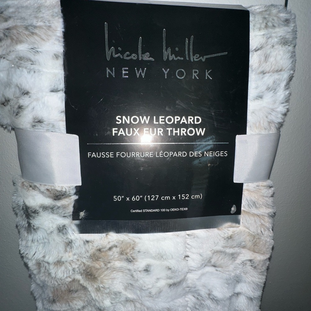Faux snow leopard blanket